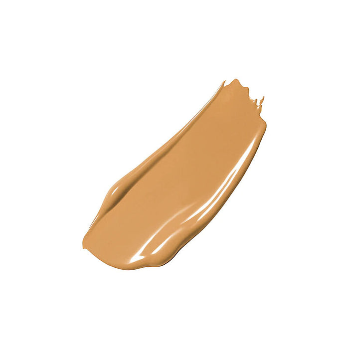 A smooth, glossy swatch of warm tan cosmetic cream, likely foundation or concealer, shown on a solid white background.