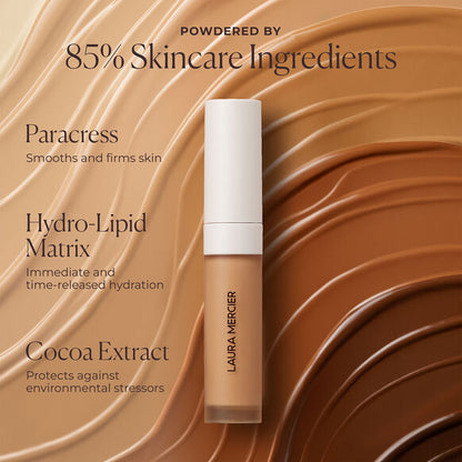 Laura Mercier skincare product with ingredients listed on a brown background