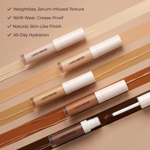Laura Mercier makeup products with color swatches on a beige background