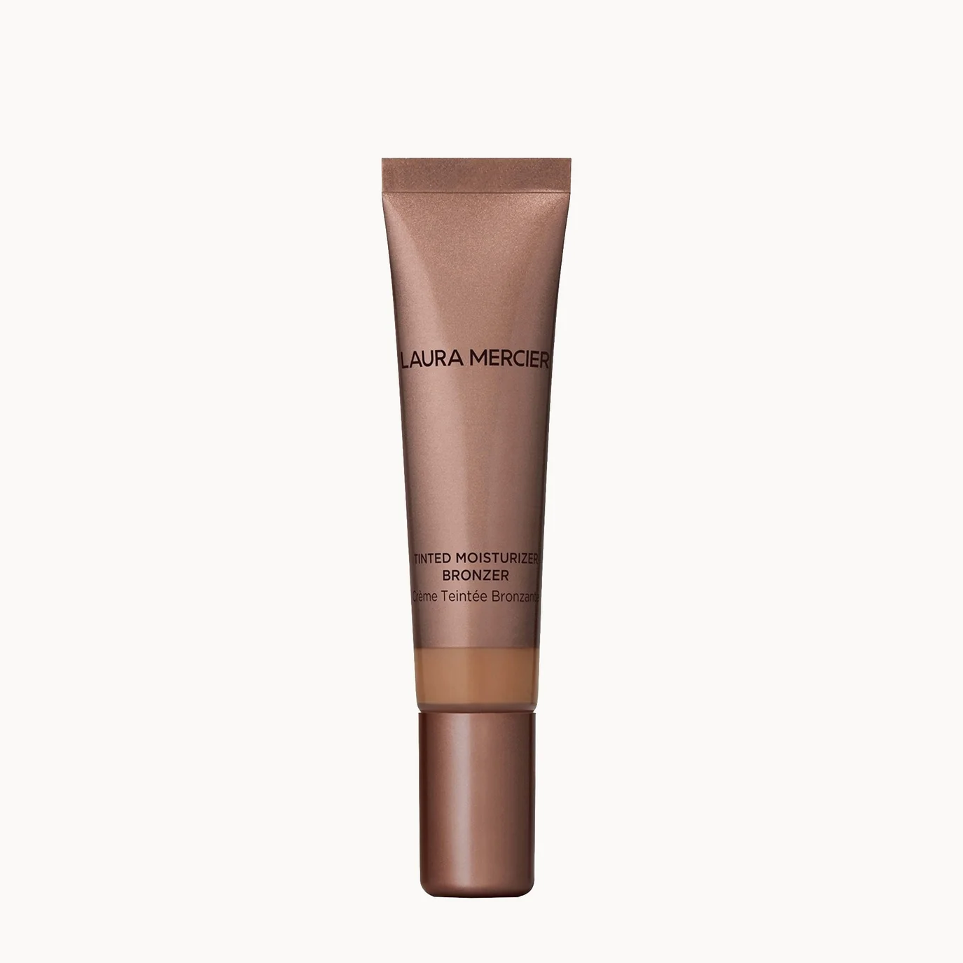 Laura Mercier Bed Breathe Moisturizing Bronzer in a metallic bronze squeeze tube with a matching cap, centered on a clean off-white background.