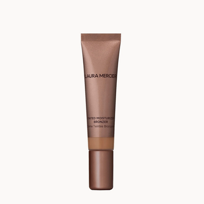 Laura Mercier Bed Breathe Moisturizing Bronzer in a metallic bronze squeeze tube with a matching cap, centered on a clean off-white background.