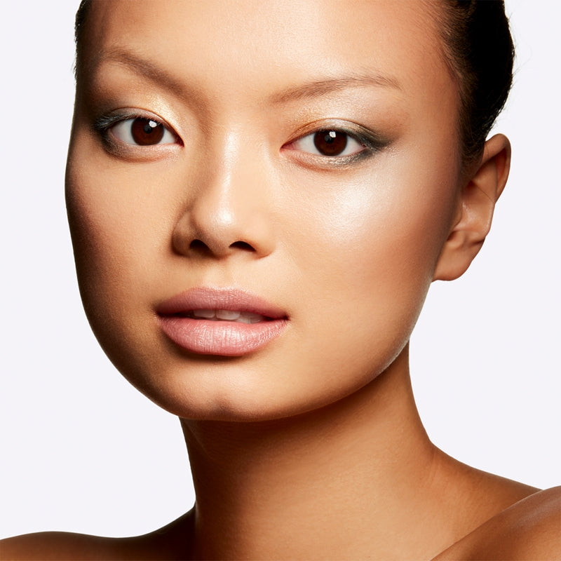 Close-up of a woman's face with a neutral background