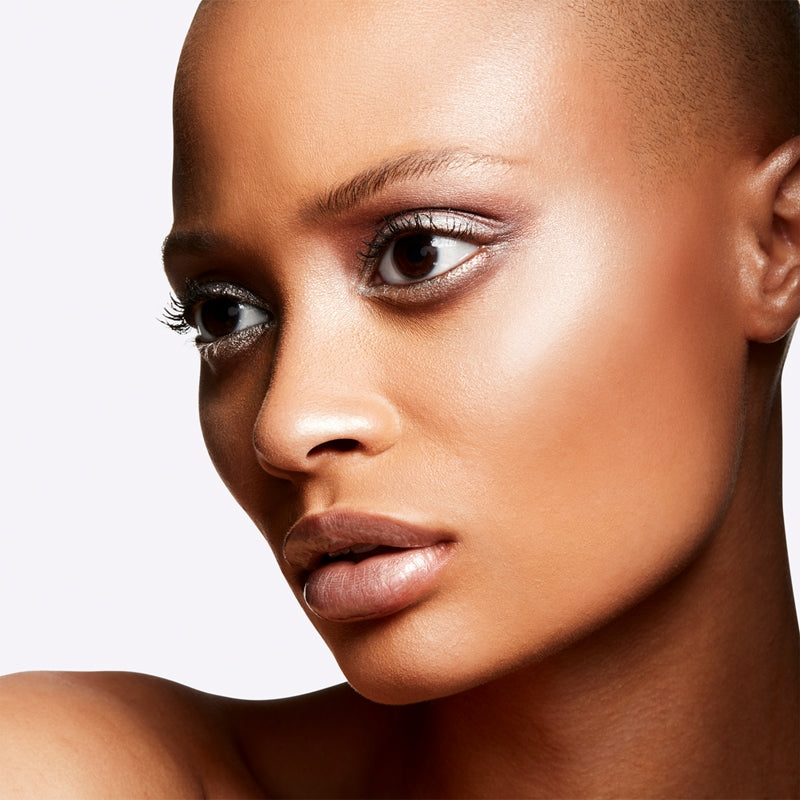 Close-up of a woman's face with a neutral background