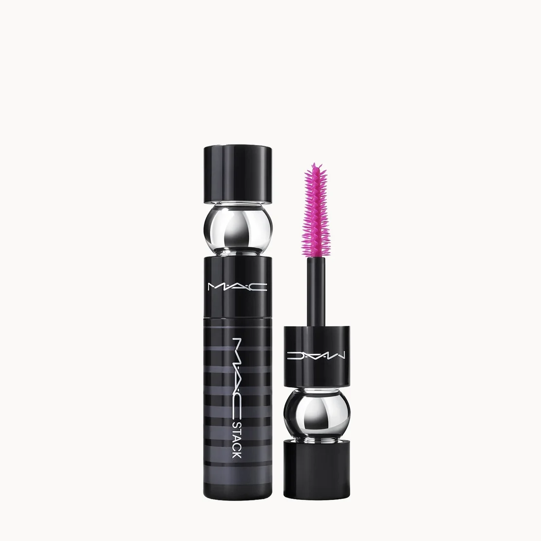 MAC Black mascara shown with the black tube and the applicator wand, which has a bright pink bristle tip, on a clean off-white background.