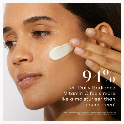 Woman applying cream to her face with a text overlay about daily radiance and vitamin C.