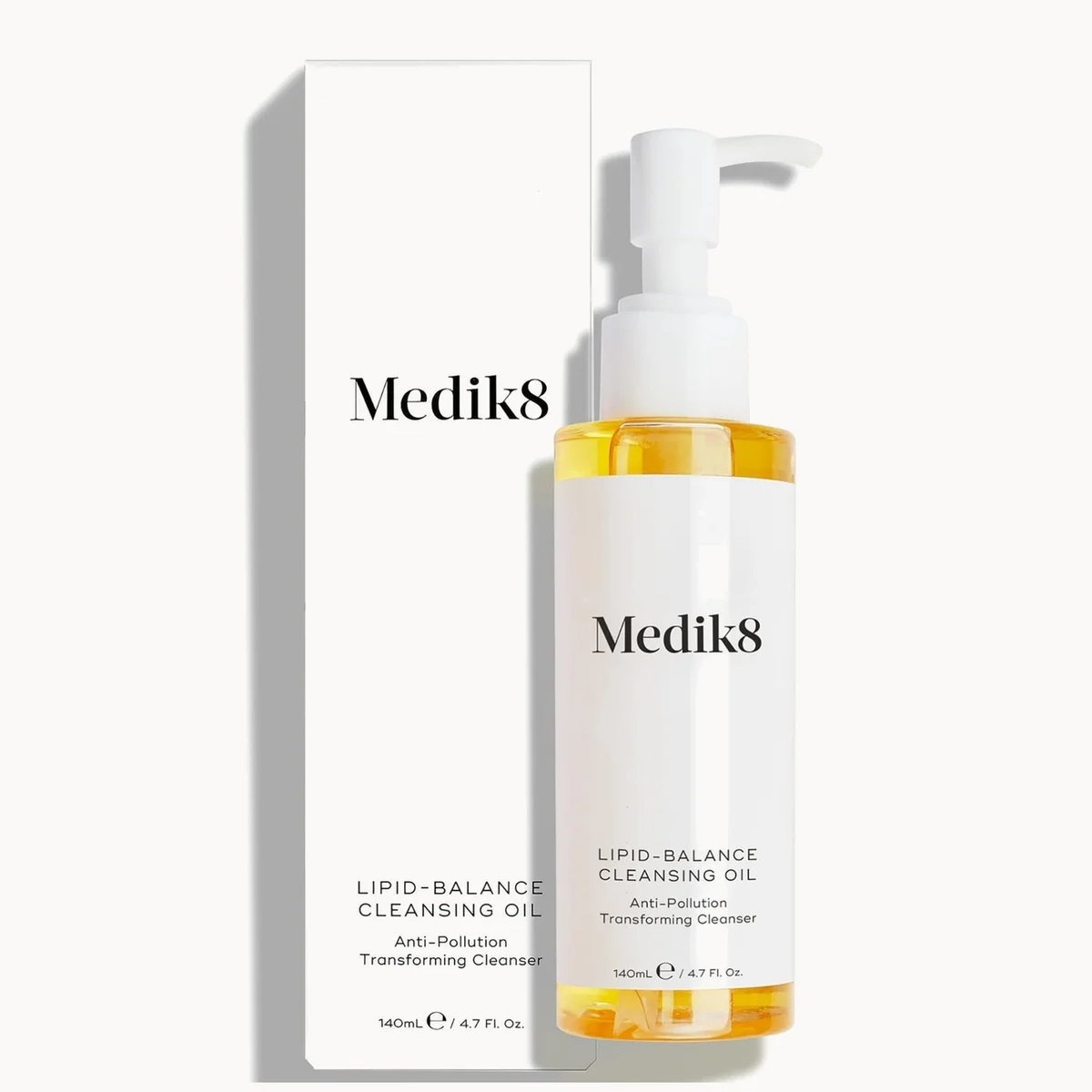 Medik8 Lipid-Balance Cleansing Oil in a 160ml pump bottle next to its white packaging box, set against a clean white background with soft shadows.