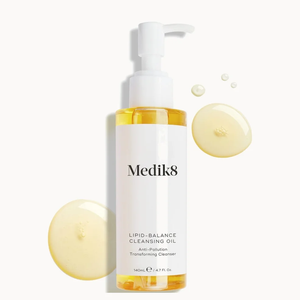 Medik8 Lipid-Balance Cleansing Oil in a 50ml white pump bottle, shown on a clean white background with decorative golden oil droplets.