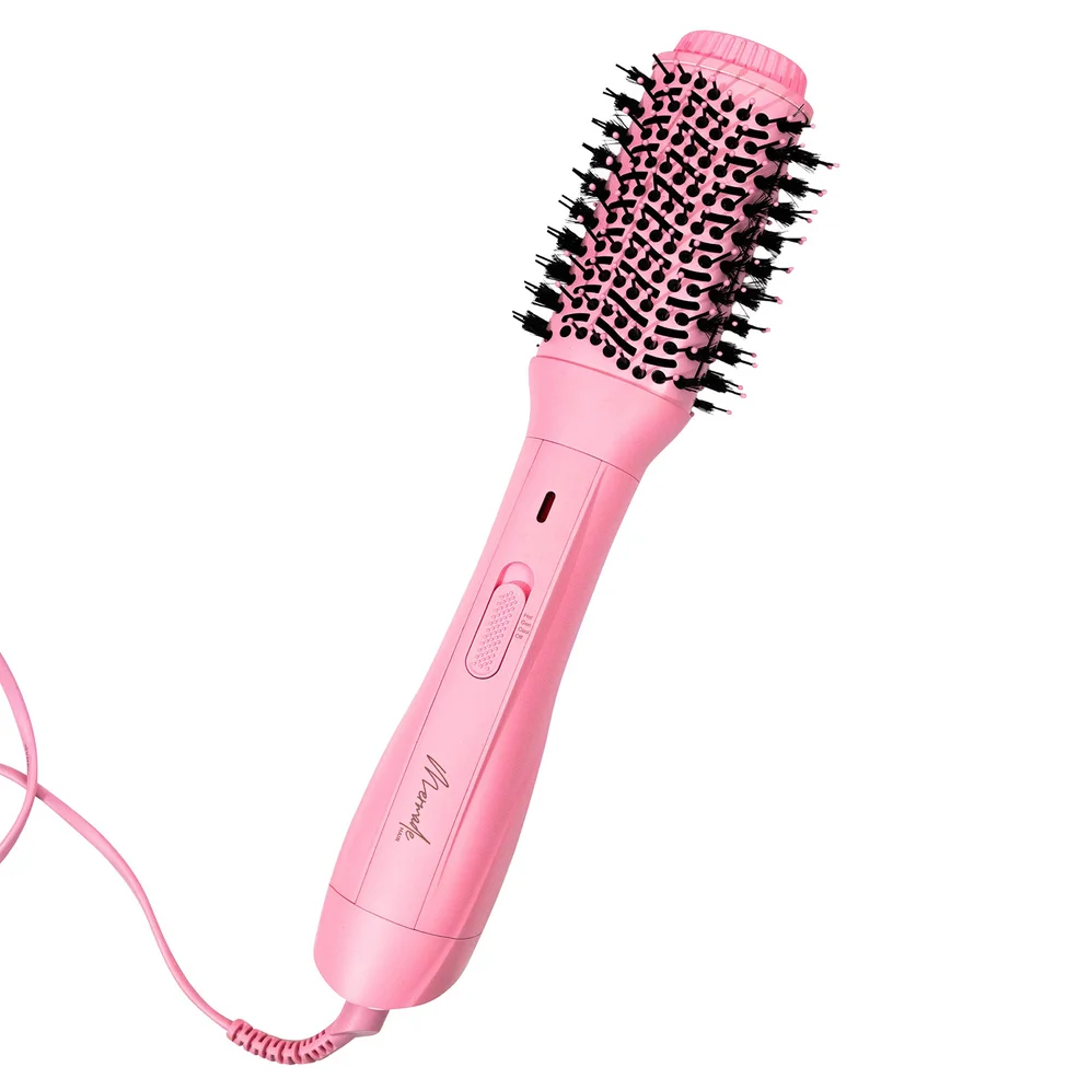 Pink hair styling tool with bristle brush head on a white background