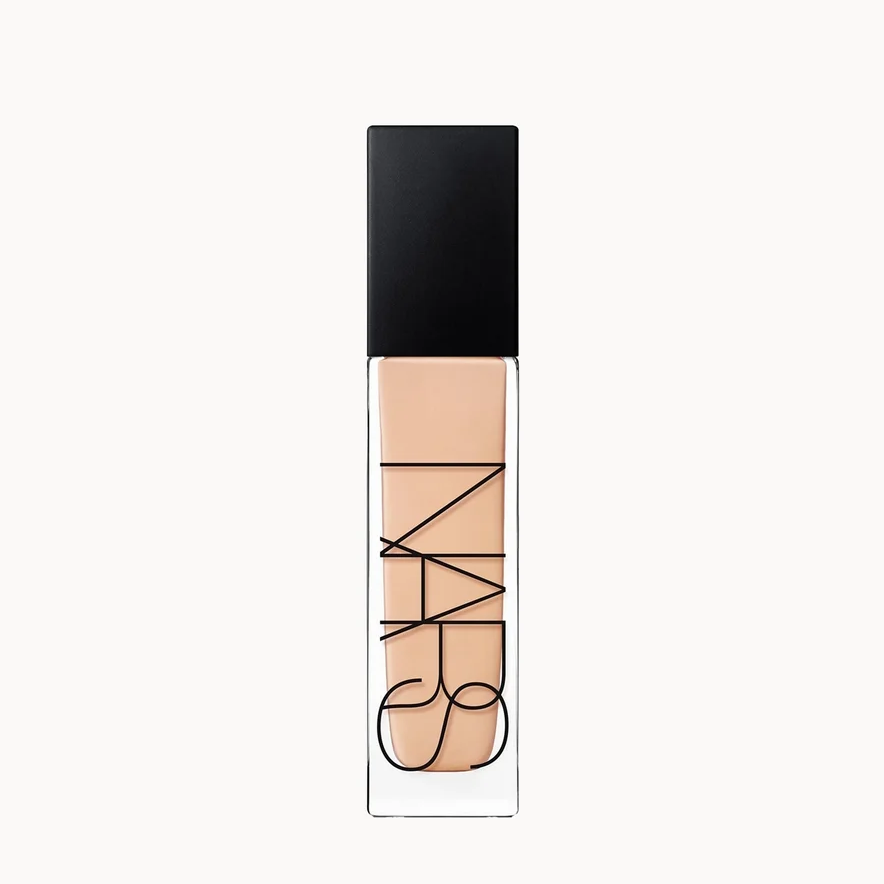 NARS liquid foundation in a clear rectangular tube showing the beige liquid formula, topped with a black cap, centered on a plain white background.