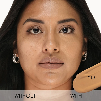 Close-up split comparison of a woman's face showing foundation application: 'WITHOUT' on the left with natural skin texture and 'WITH' on the right with smoother, more even coverage. A beige makeup swatch labeled 'Y10' appears on the lower right.