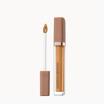 Natasha Denona liquid concealer shown with the applicator wand and cap beside the open tube, on a clean white background.