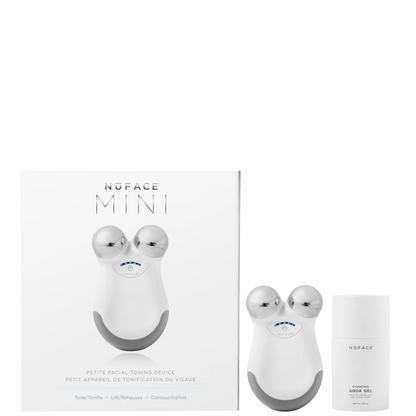 NuFACE Mini facial device with packaging and a bottle on a white background