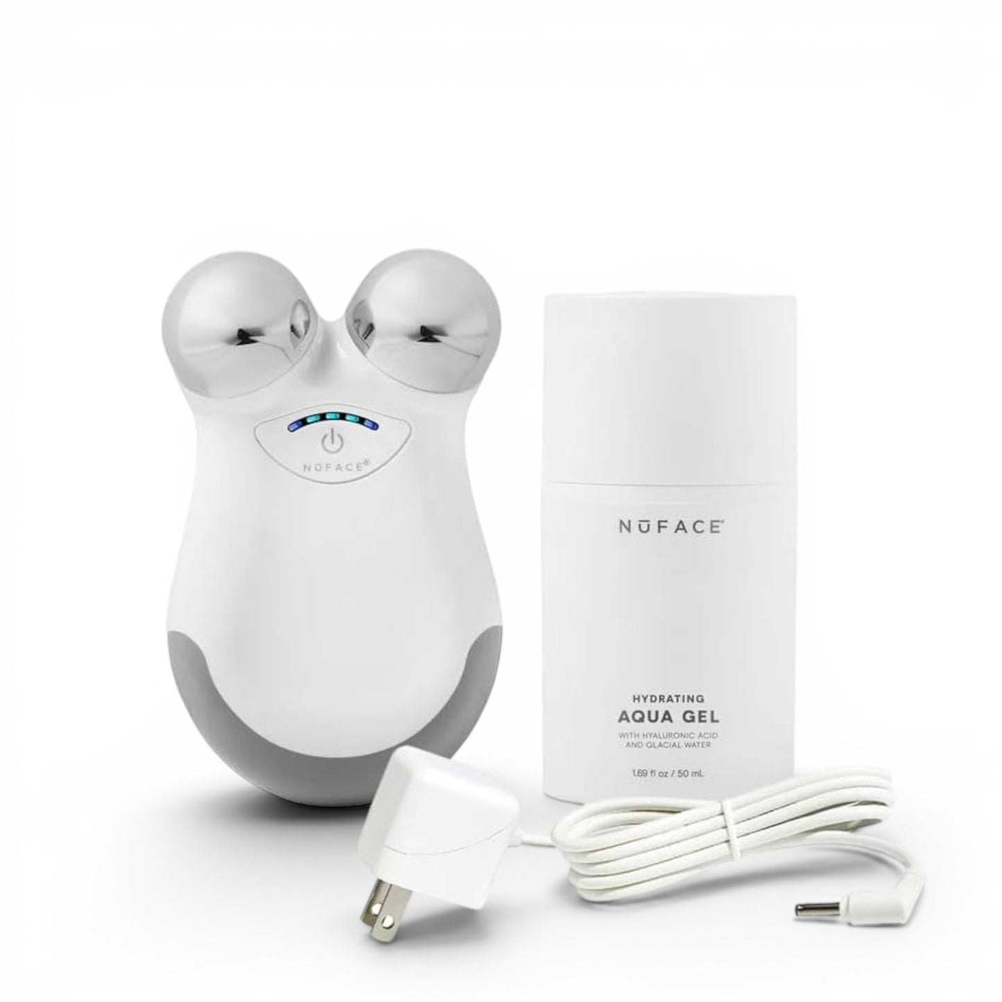 NuFace facial toning device with packaging and cable on a white background