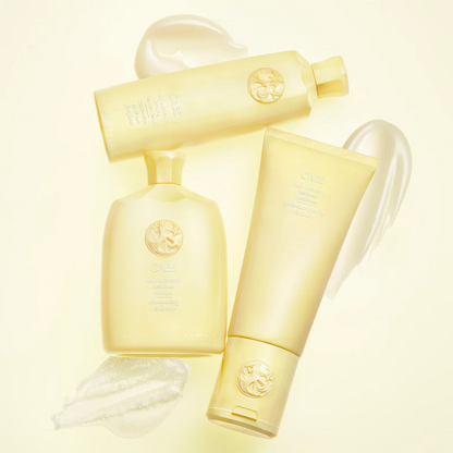 Three pale yellow cosmetic bottles and tubes arranged on a light cream background with translucent gel swatches. The embossed logo and text indicate CeraVe.