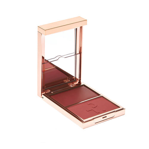 Compact blush with rose gold case on a white background