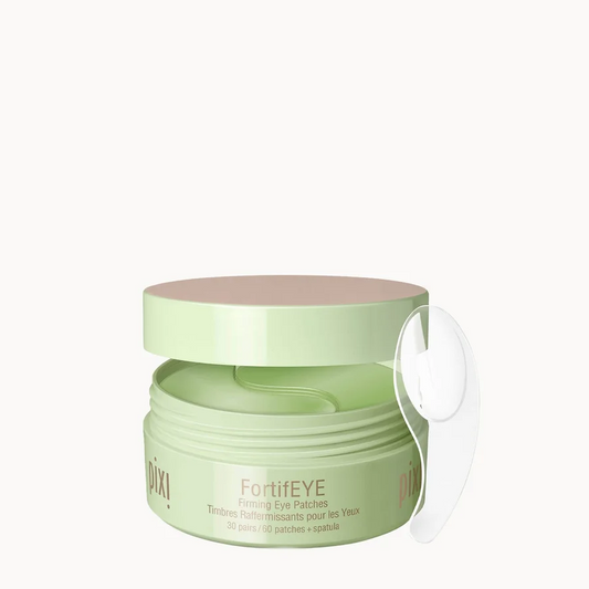 A light green jar of FortiEye Piling Eye Cream with a matching lid and a clear plastic applicator loop, set against a solid off-white background.