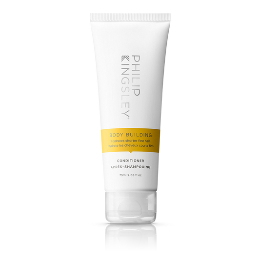 Tube of Philip Kingsley Body Building Conditioner on a white background