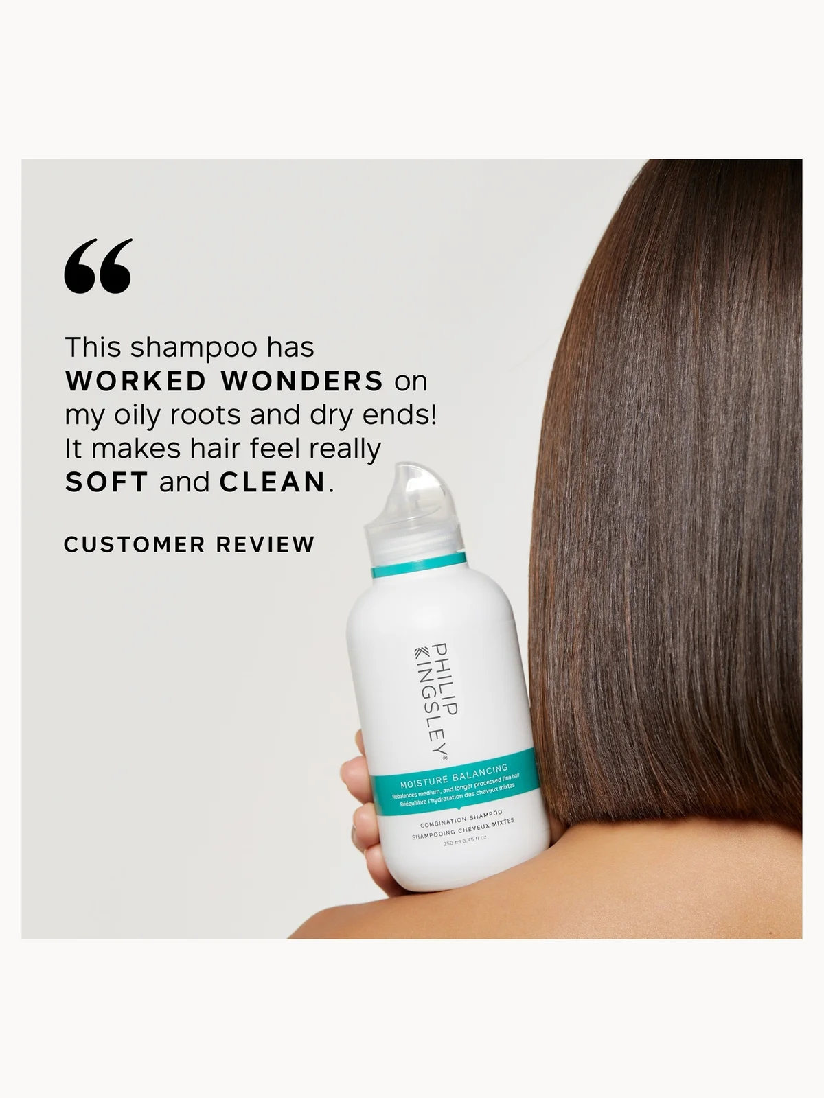 Shampoo bottle held by a person with long hair, featuring a customer review quote.
