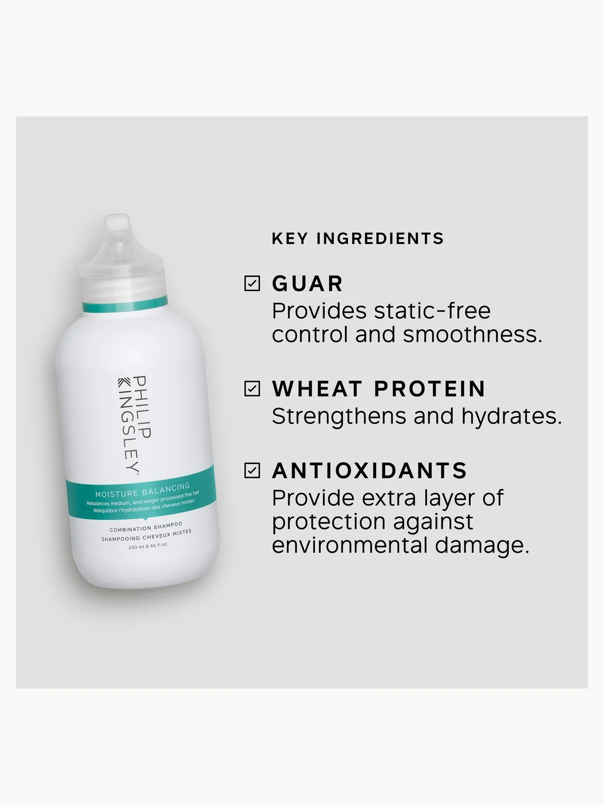 Bottle of Philip Kingsley product with key ingredients listed on a gray background