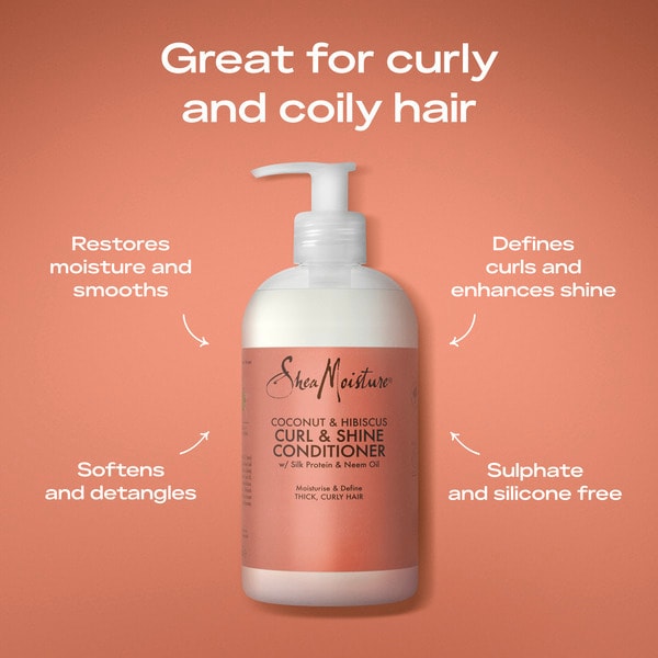 Shea Moisture Coconut & Hibiscus Curl & Shine Conditioner bottle centered on a peach background with marketing text around it for curly and coily hair.
