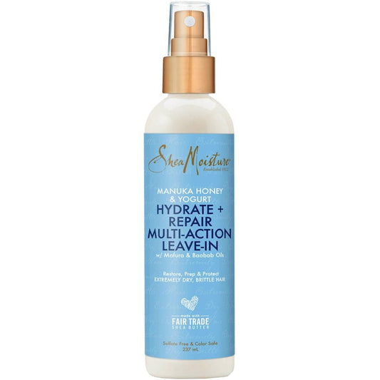 SheaMoisture Manuka Honey & Yogurt Hydrate + Repair Multi-Action Leave-In hair care spray bottle with a light blue label and gold spray top, shown on a white background.