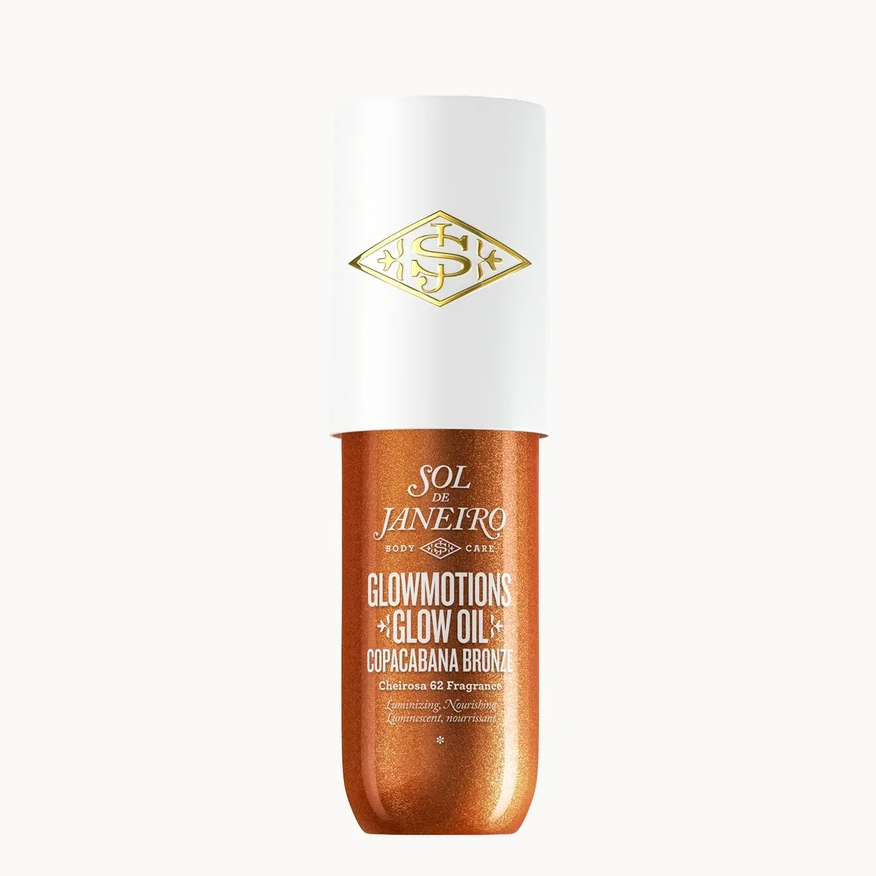 Sol Jinefro Glowmotions Glow Oil Pop-Cream Spray in a metallic copper-orange bottle with a white cap and gold logo, centered on a plain white background.