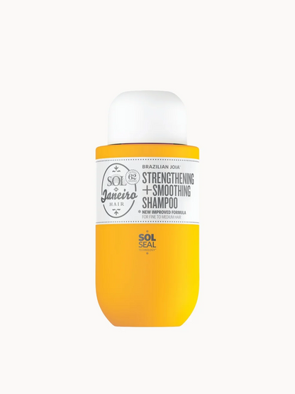 Yellow shampoo bottle with white cap on a white background