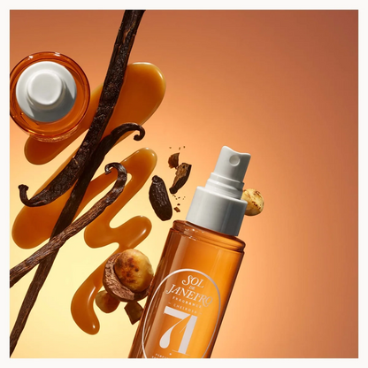 A bottle of Sol-de-Janeiro-Cheirosa 71% Vanilla Bean Hair and body mist shown with floating vanilla beans, vanilla extract, and vanilla seeds against a warm orange gradient background.