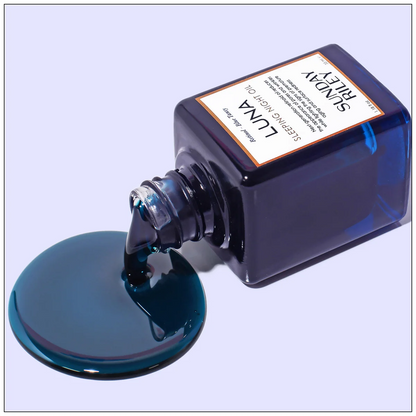 Blue ink bottle with a label on a light blue background