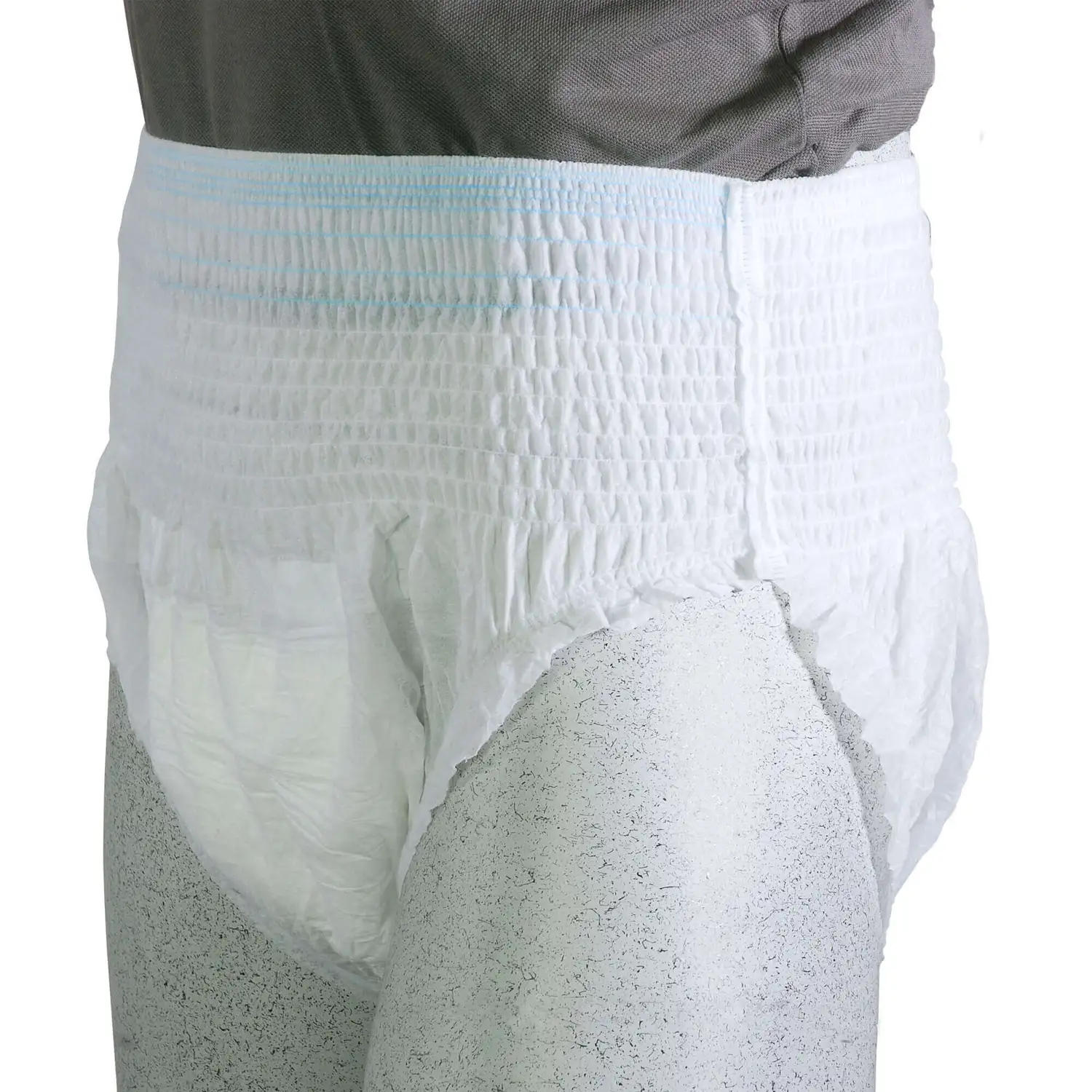 White incontinence pants worn by a person on a white background