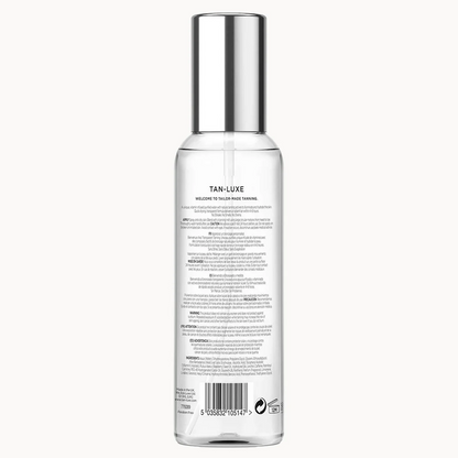 Tan-Luxe Welcoming You Body Tanining spray bottle, showing the back label and barcode on a clean white background.