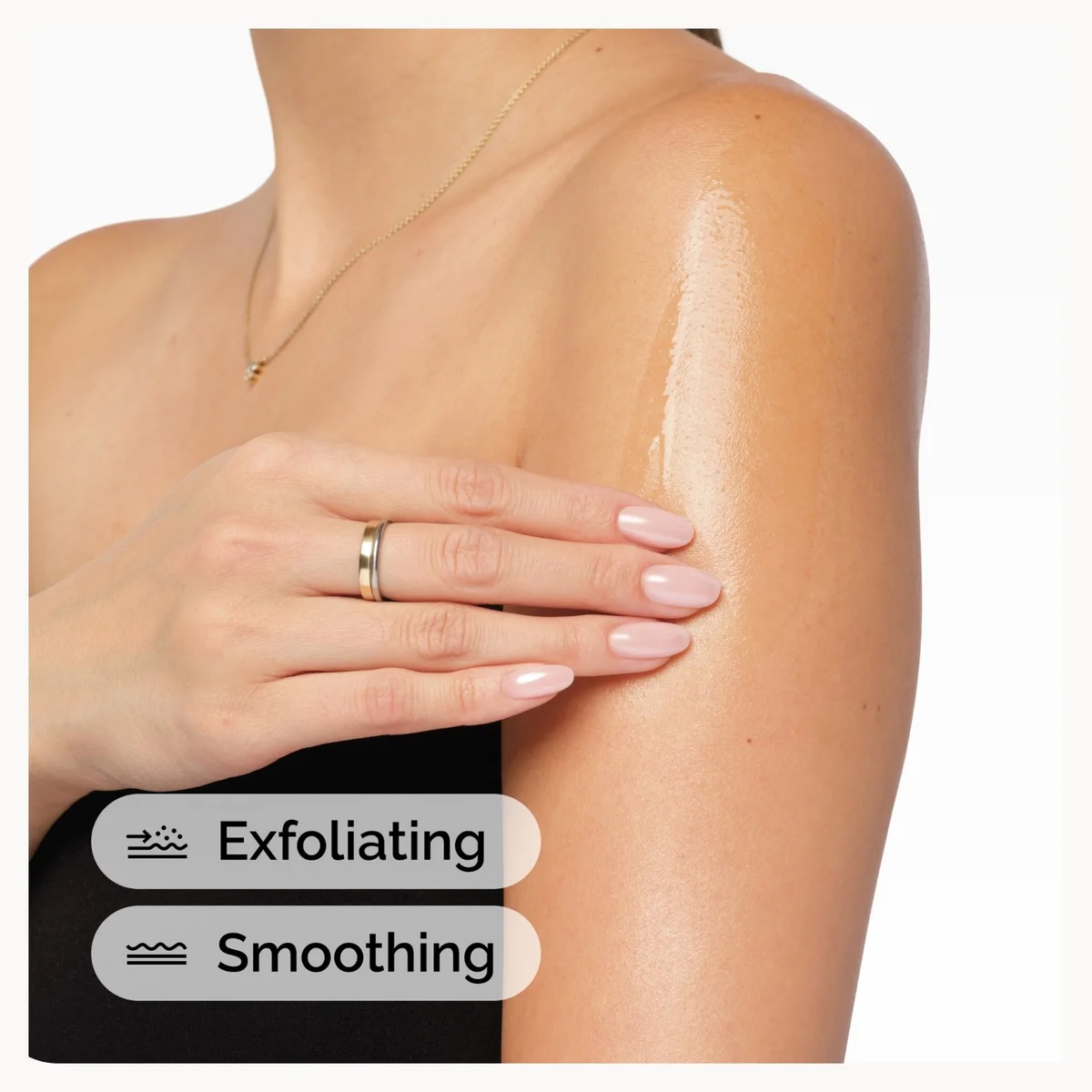 Woman's arm with a hand gently touching skin, labeled 'Exfoliating' and 'Smoothing'.