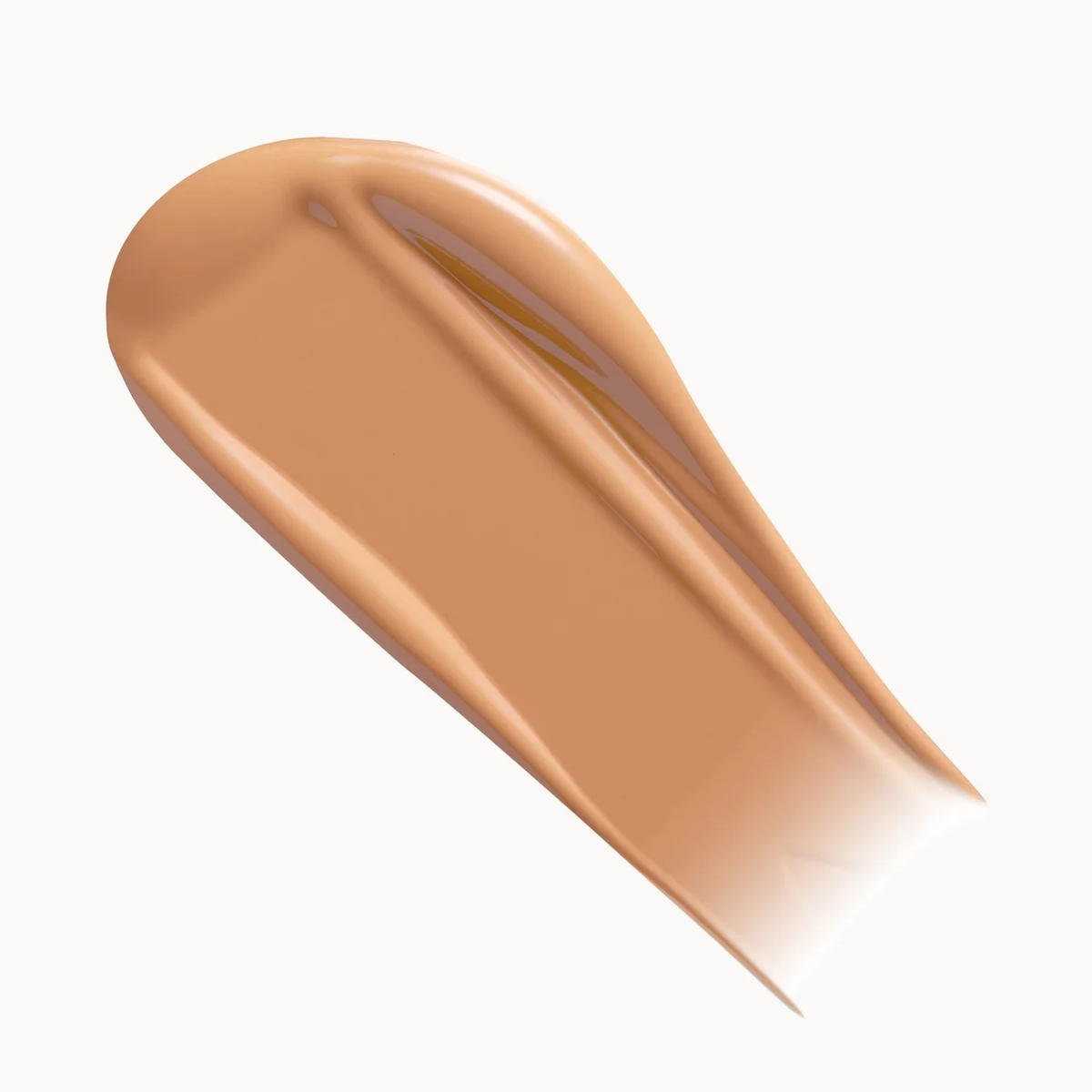 A smooth, glossy swatch of liquid foundation or concealer in a warm light tan shade, presented on a clean white background.