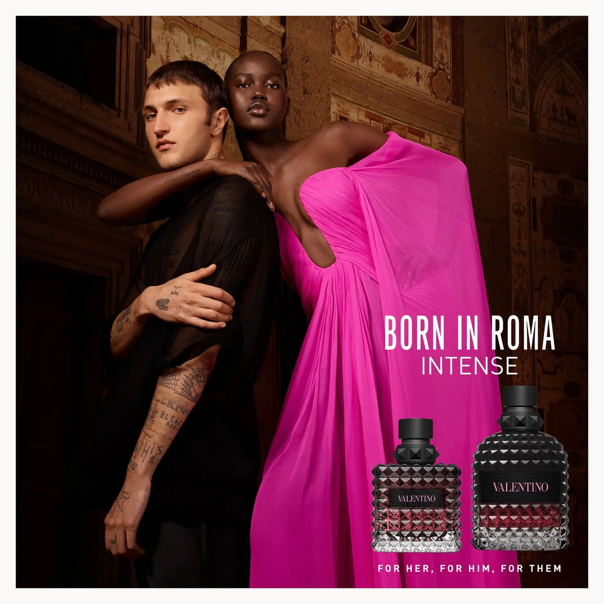 Two people embracing with Valentino perfume bottles and 'Born in Roma Intense' text.