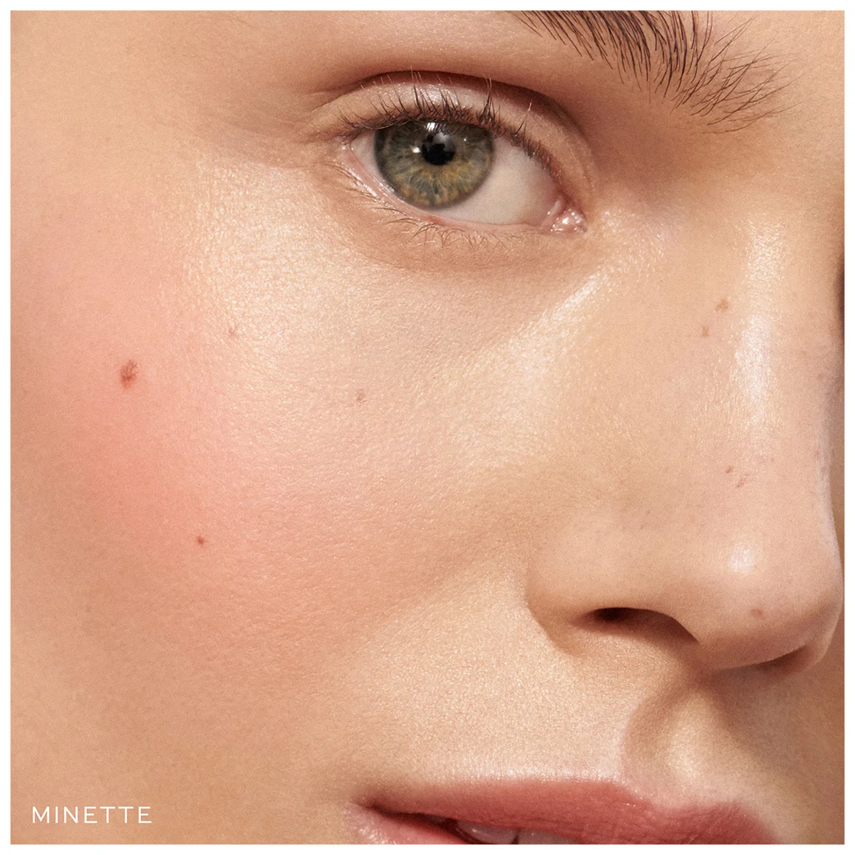Close-up of a model's face showing a skin texture swatch labeled MINETTE in the bottom-left corner.