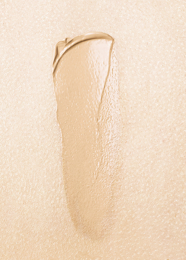 Beige cosmetic cream swatch on a beige background