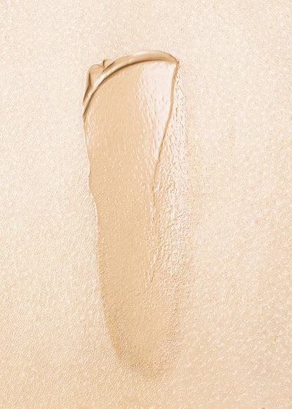 Beige cosmetic cream swatch on a beige background