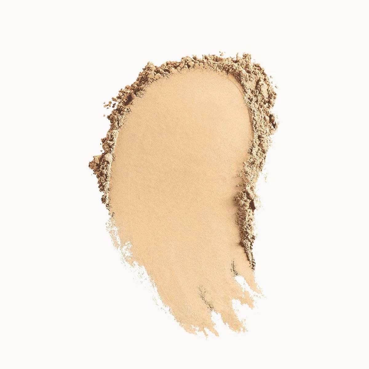 A textured smear of loose face powder in a warm light beige shade, showing both the pressed powder texture and the loose pigment, set against a solid white background.