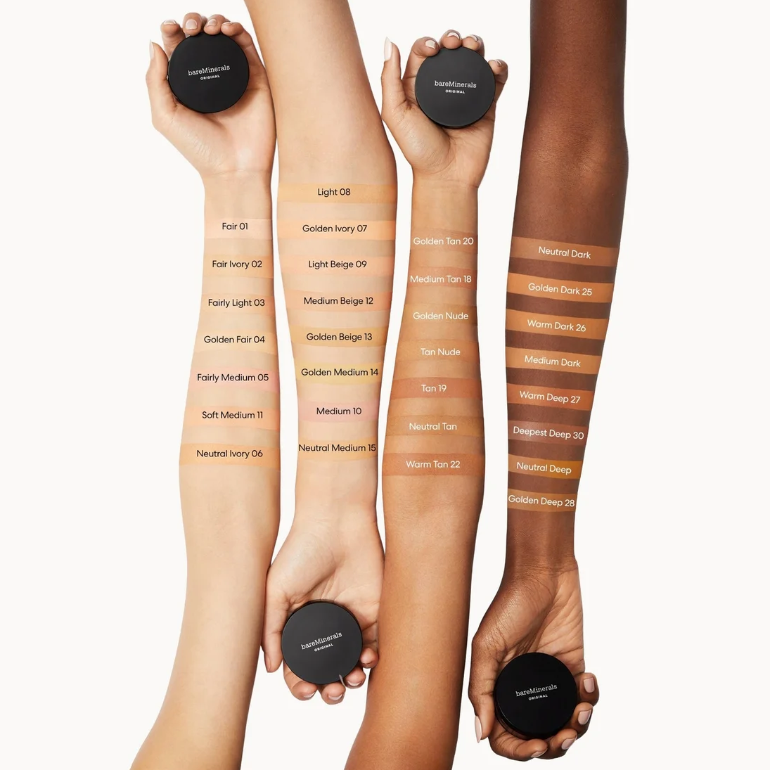 Four human arms and hands holding round black makeup compacts against a light gray background, with vertical swatches of foundation or tint labeled on the arms showing different shade options.