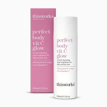 Thisworks Perfect Body Vit C Glow body brightener shown as a white pump bottle next to its pink packaging box on a light gray background.