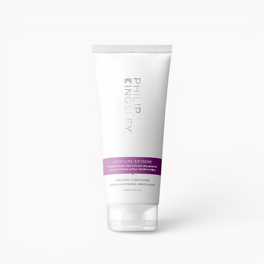 Tube of Philip Kingsley Moisture Extreme conditioner on a white background