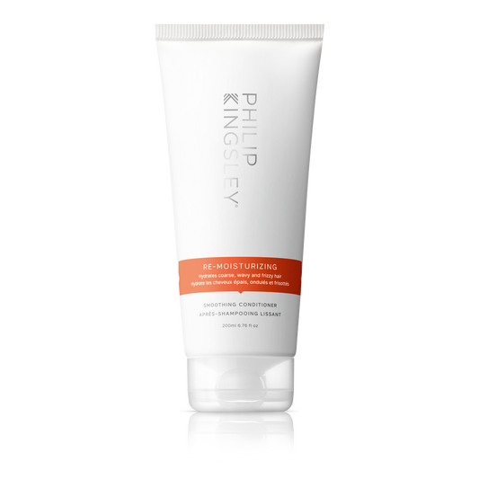 Tube of Philip Kingsley Re-Moisturizing Conditioner on a white background